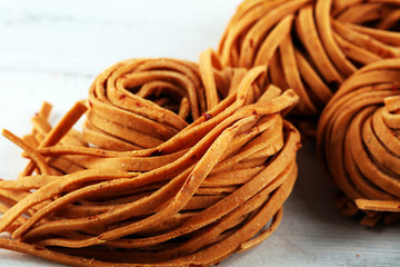 Wall Mural - Closeup of raw homemade chili pasta. fresh italian traditional raw fresh pasta