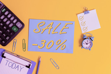 Wall Mural - Conceptual hand writing showing Sale 30 Percent. Concept meaning A promo price of an item at 30 percent markdown Clipboard clips sheet calculator pen clock color background