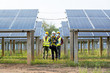 © visoot - Engineer wearing protective mask to Protect Against Covid-19 working on checking and maintenance equipment at industry solar power,Solar cells will be an important renewable energy of the future.