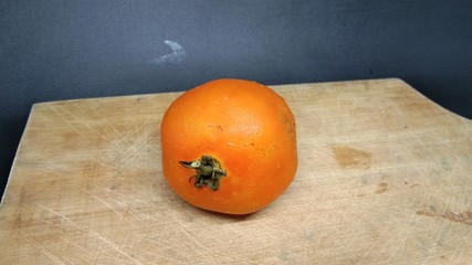 Red, Fresh ripe tomato on a dark background.