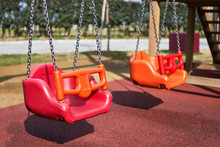 Swings On The Playground In The Children Park