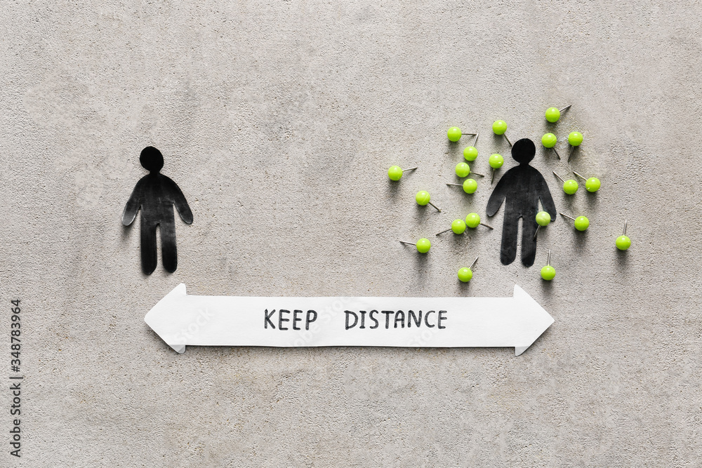 Human figures with text KEEP DISTANCE on grunge background