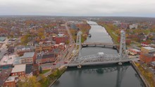 Aerial Drone View Of Vehicles Driving Across Welland Canal Bridge Thirteen On A Cloudy Day
