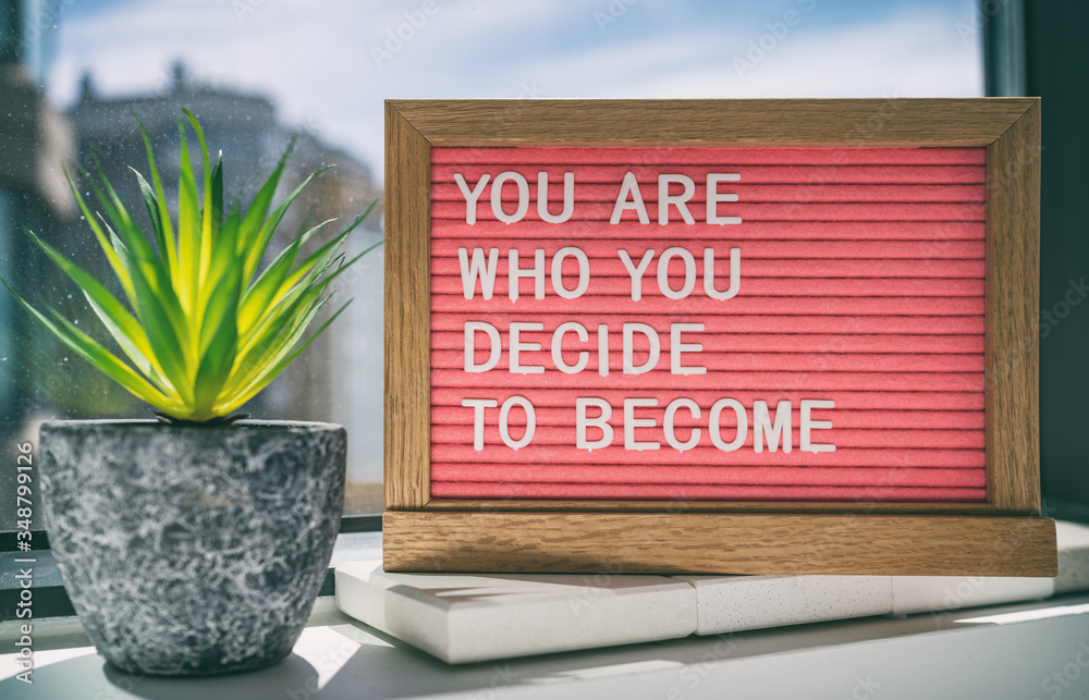 Inspiration quote message sign saying You are who you decide to become - life advice for self esteem, confidence. Home background. - obrazy, fototapety, plakaty 