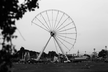 Abandoned Ferris Wheel Against Clear Sky On Field