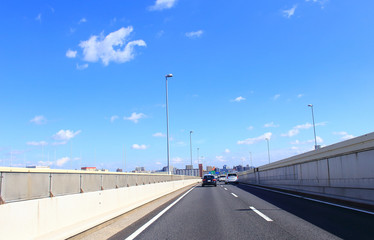 Car driving on metropolitan expressway