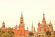 Illustration: Moscow's kremlin. View of the Spasskaya tower and St. Basil's Cathedral. The City Of Moscow, Russia