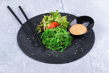 Wall Mural - Japanese Cuisine - Chuka Seaweed Salad. Served with Nuts Sauce and Sesame