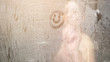 © lenblr - blurry naked lady draws smile on white steam condensate on glass-enclosed shower door in bathroom at home close view