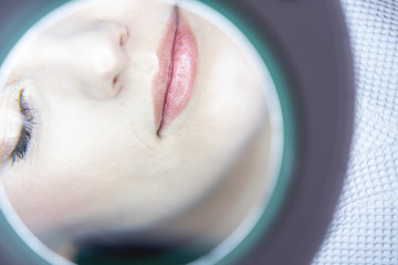 Female patient skin being examined by a doctor