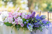 Bouquets Of Fresh Flowers Decoration Of The Festive Table. Celebrating An Open Air Party. Decor Details