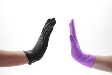 hands close-up dressed in latex or rubber gloves, greeting, handshake, palms.