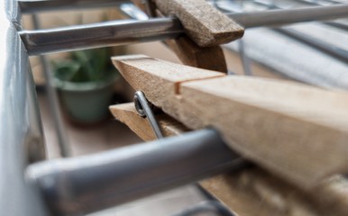 artistically placed wooden clothespins with blur background