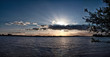 Sunset panorama, beam over cloud, above lake, sun rays over clouds, scenic evening with sun