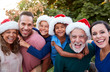 © Monkey Business - Portrait Of Multi-Generation Hispanic Family Relaxing In Garden At Home Together At Christmas