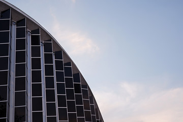 futuristic, modern design of the glass facade of the building.