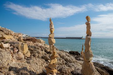 Wall Mural - 
Stone sculptures in Zen balance on the south coast of Peñíscola, Mediterranean Sea