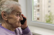 © Cliff - Elderly woman talking on smartphone