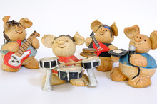 Figure Of A Ceramic Pig Playing Music Bassist, Guitarist, Singer And Drummer