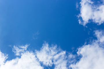 Background of blue sky with white clouds in a frame. Ready layout, space for text. Selective focus.