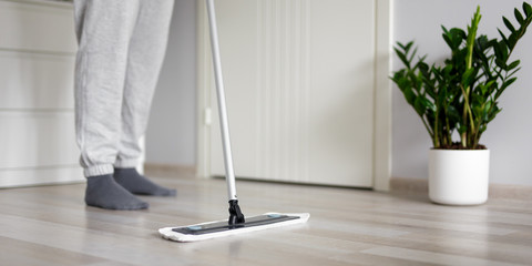 Wall Mural - housewife washing wooden floor at home