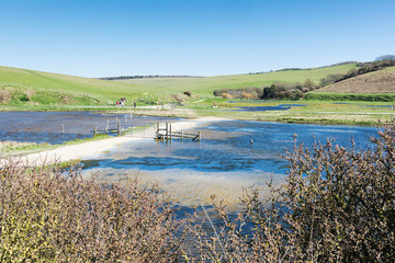 Wall Mural - Views of Cucmere river near Seaford and Eastbourne, East Sussex, footpath leading to Cuckmere Haven beach, selective focus