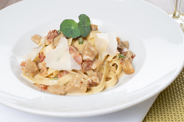 Wall Mural - Tagliatele pasta with porcini, bacon and sage. Traditional Italian recipe from authentic cuisine