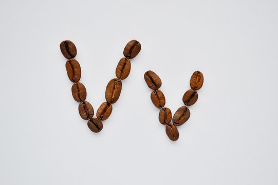letters v made of coffee beans on the white background