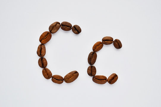 letters c made of coffee beans on the white background