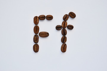 letters f made of coffee beans on the white background