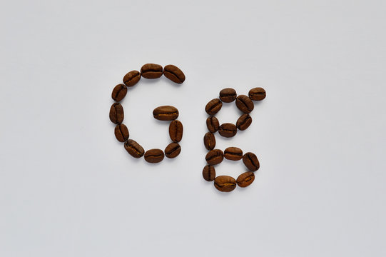 letters g made of coffee beans on the white background