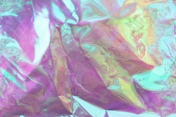 Wall Mural - Blurred light rainbow crumpled holographic background.