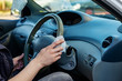 © Мария Чичина - Hands wipes the steering wheel with an antibacterial cloth. Infection control concept. Prevent Coronavirus, COVID-19, flu.