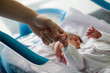 © галина шарапова - Beautiful newborn baby boy, laying in crib in prenatal hospital