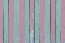 Old Two-tone Light Pastel Blue And Pastel Pink  Wooden Fence With Peeling Paint