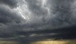 Leinwandbild Motiv Dark clouds, dramatic storm background. Abstraction of weather conditions.