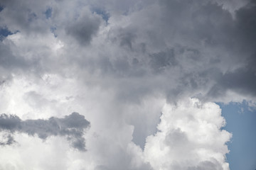 Wall Mural - terrible thunderclouds from the side of a plane. gloomy epic clouds. background image in a dark gray