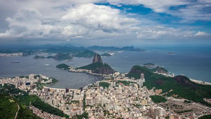 Wall Mural - Rio de Janeiro, Brazil, time lapse view of Sugarloaf Mountain and Rio cityscape during summer.