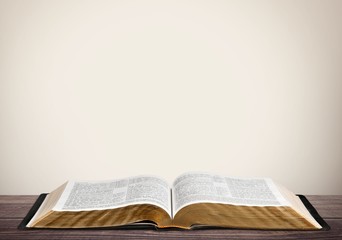 Wall Mural - open book on old wooden table.