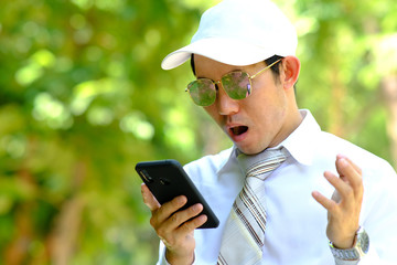 Poster - businessman using a smartphone and space for text