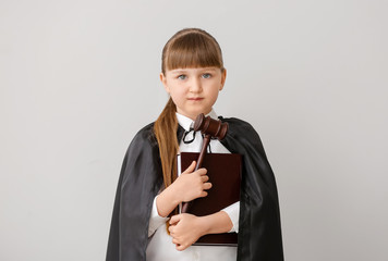 Sticker - Portrait of little judge on grey background