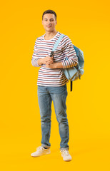 Wall Mural - Portrait of male student on color background