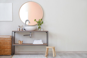 Interior of bathroom with fresh flowers