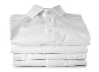 Stack of clean clothes on white background