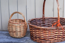 Ancient Wicker Basket On A Wooden Background. Selective Focus