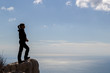 © ciroorabona - hiker on mountain peak with sea below