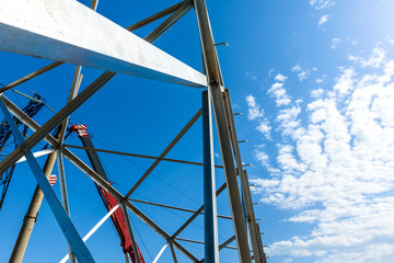 High voltage electric pillar from under. A high-voltage electricity tower