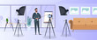 © Javvani - A man in a business suit with a tie is giving a presentation to the camera. The teacher is writing a lesson. The concept of blogging, online training and conferences. Camera on a tripod, softbox.