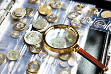 Numismatic Coins With Magnifying Glass