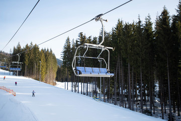 Empty ski-lift in the mountains. End of ski season